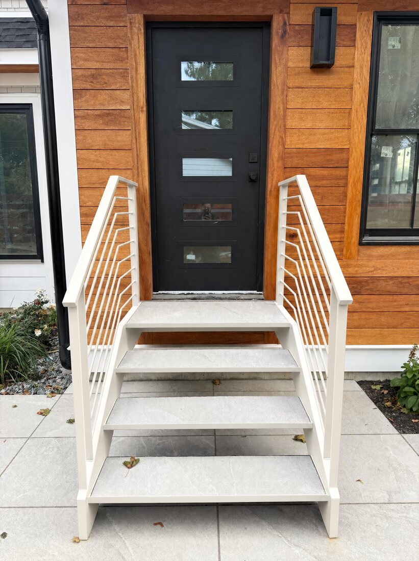 Floating exterior staircase in a warm white finish