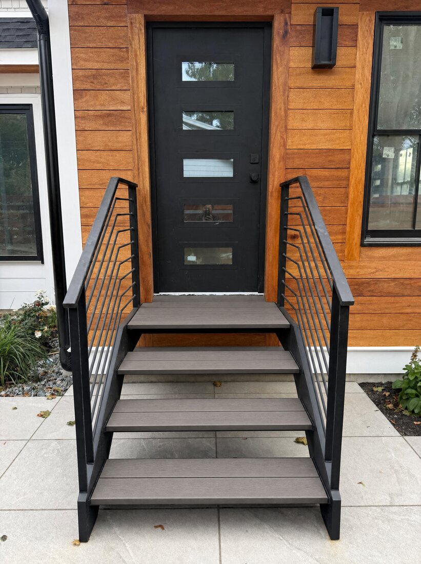 Floating exterior staircase with composite treads