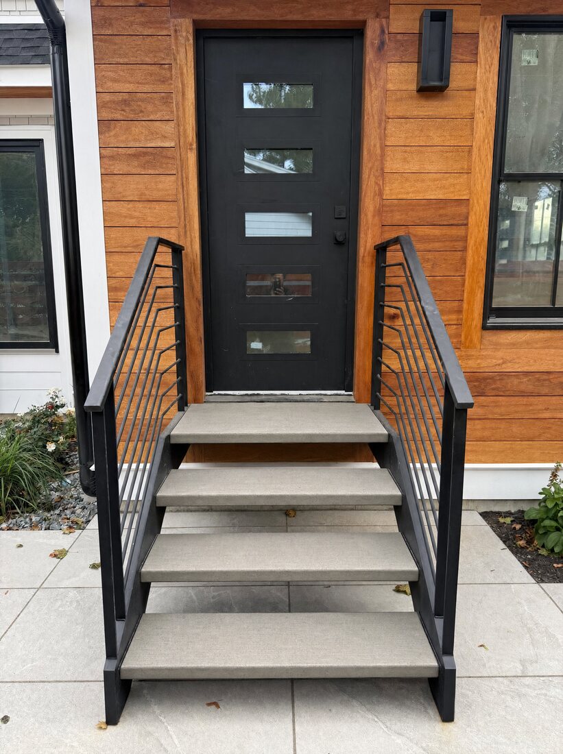 Floating exterior staircase with concrete treads