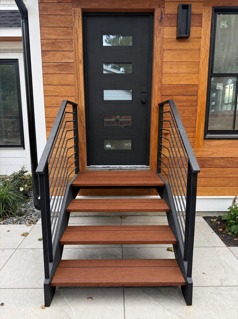 Floating exterior staircase with wood treads